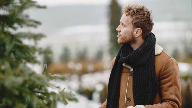 A man standing in the cold comtemplating his hair transplant